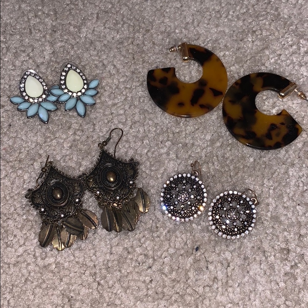 Set of 4 statement earrings.